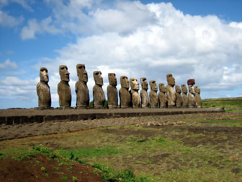 A row of restored moai statues standing on the Ahu Tongariki ceremonial platform on Rapa Nui.