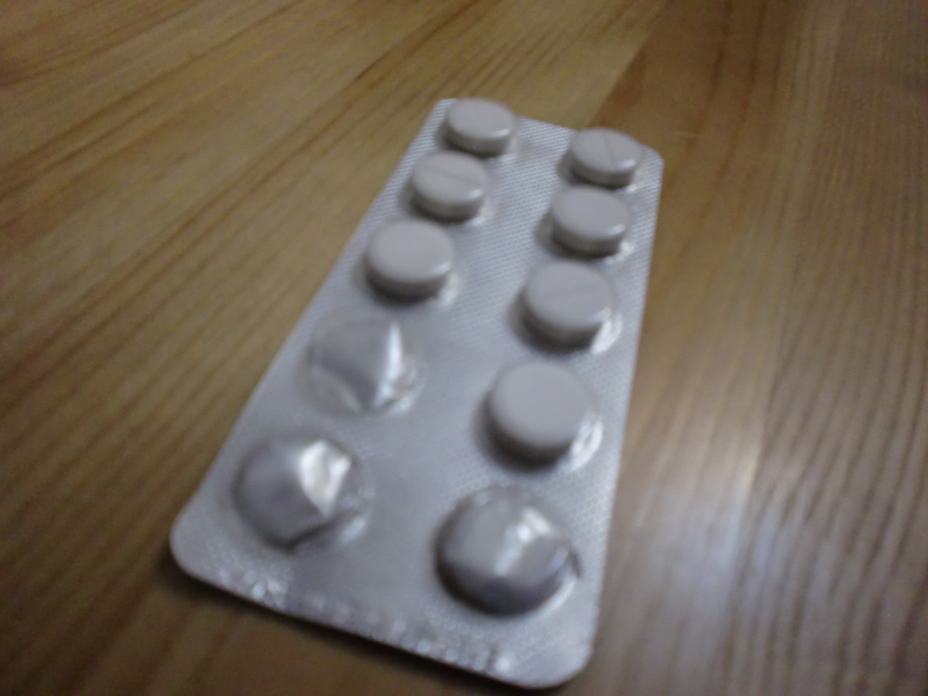 Assorted capsules on a white background, representing placebo pills in medical research.