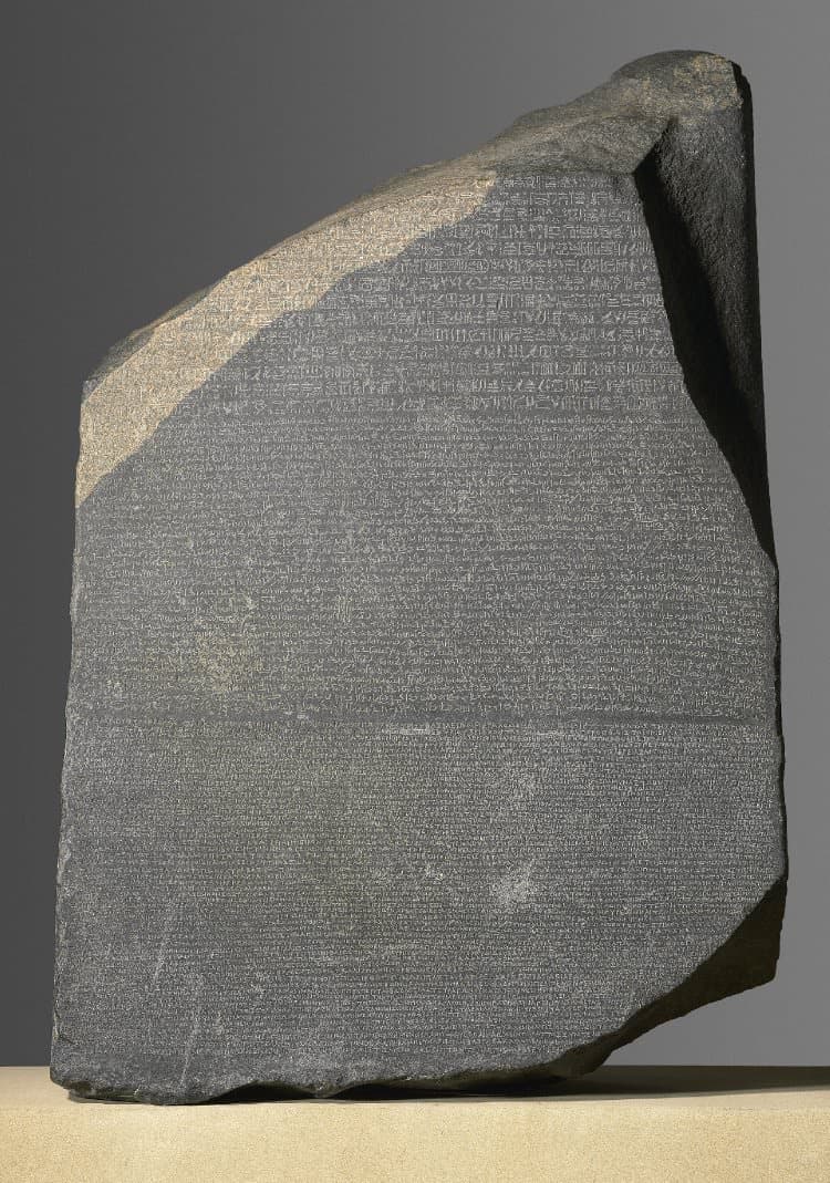The Rosetta Stone with hieroglyphic, Demotic, and Greek inscriptions.