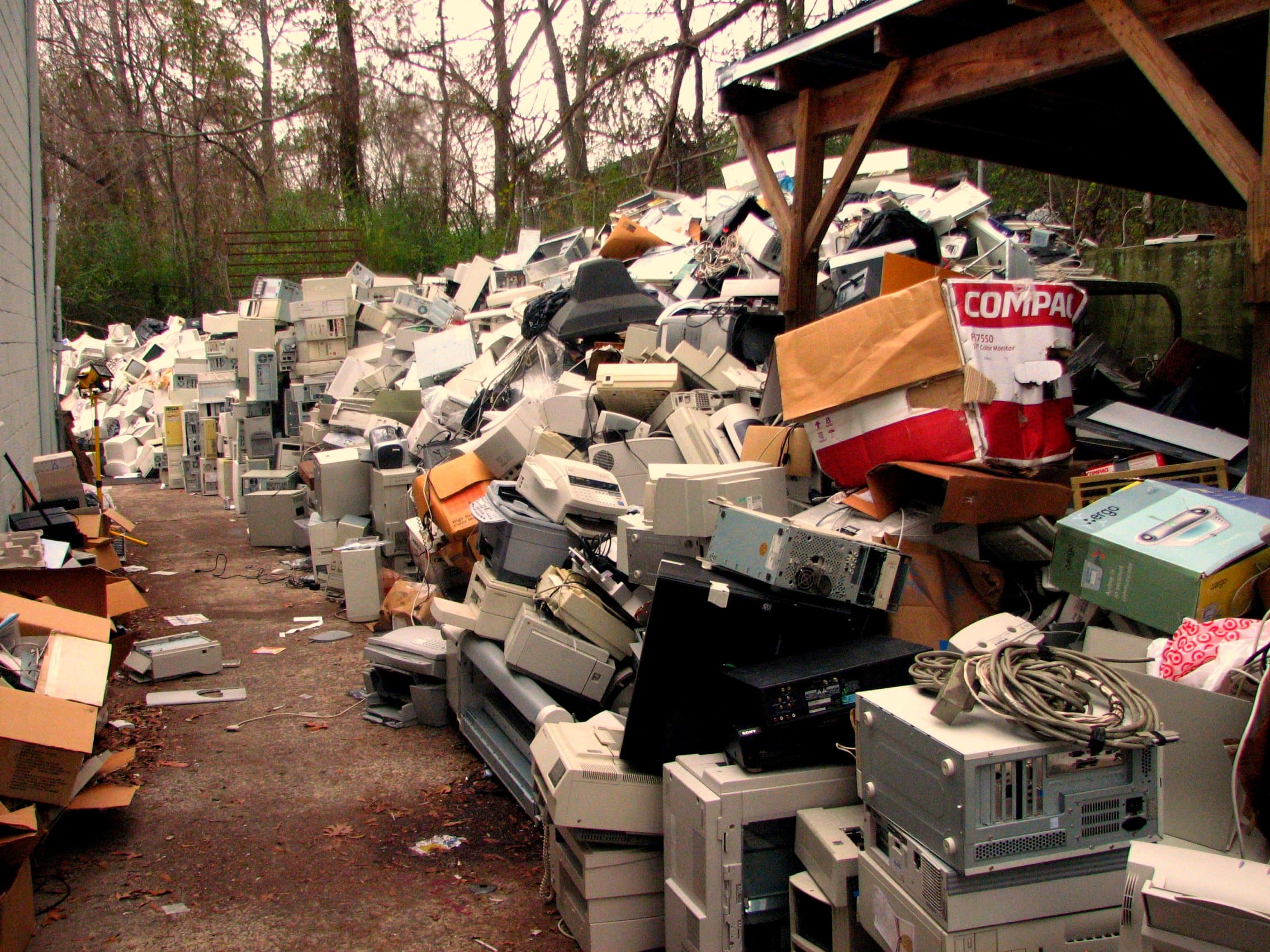 A pile of discarded electronic devices and components.