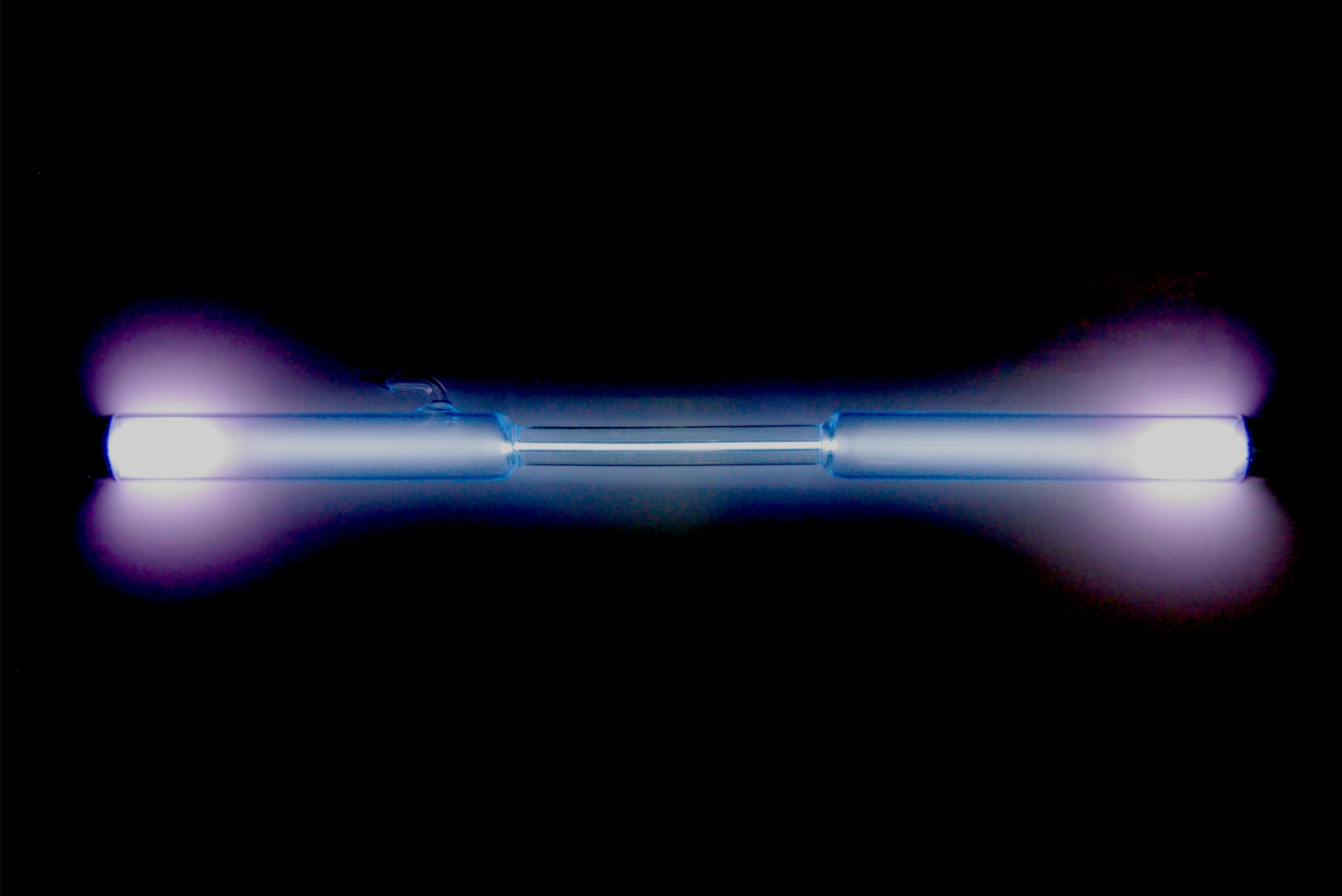 A xenon gas discharge tube glowing blue-white.